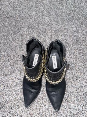 Steve Madden Black Pointed Toe Ankle Boots with Gold Chain Accent